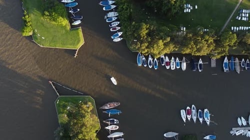 Boats moored in San Isidro Yacht club along Rio de la Plata river at sunset, Buenos Aires in Argenti