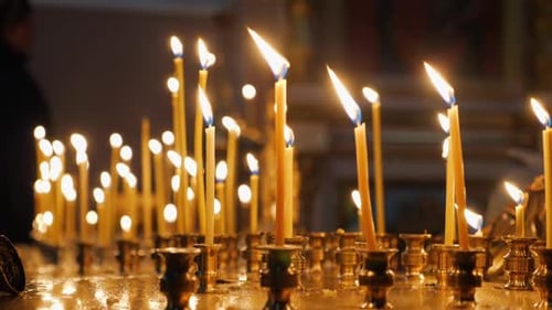 Candles Burning Brightly in Low Light