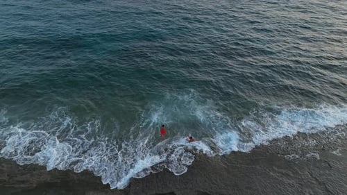 Aerial View A Radiant Mediterranean Sunset Reflects Across Calm Waters with Dramatic Clouds