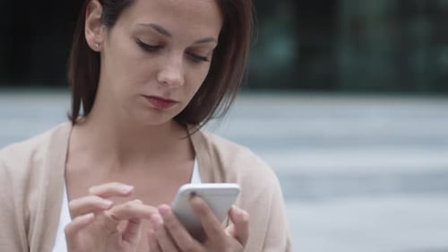 Woman Using Smartphone in the City, Close Up