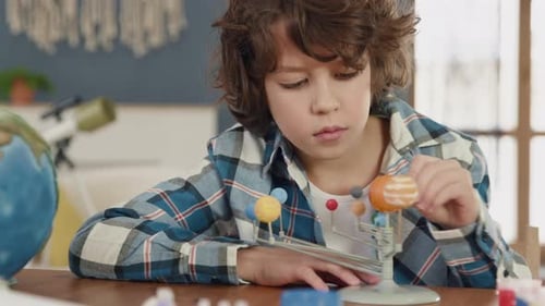Painting a portrait of a model by a clever school pupil exploring space dream