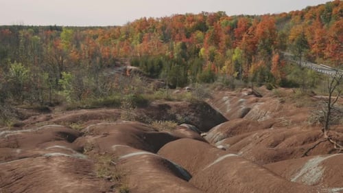 Amazing Clay Hills Formation At Cheltenham Badlands Surrounded By Forest Of Brightly Autumn Leaf Col