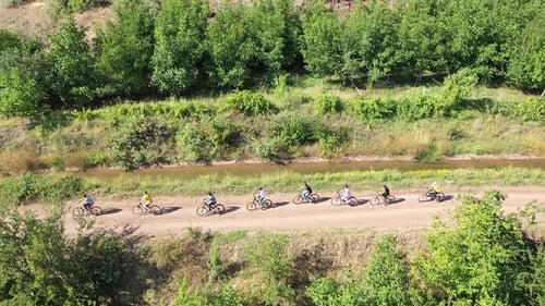 Group Of People On A Bike Trip In Nature, Drone Shot