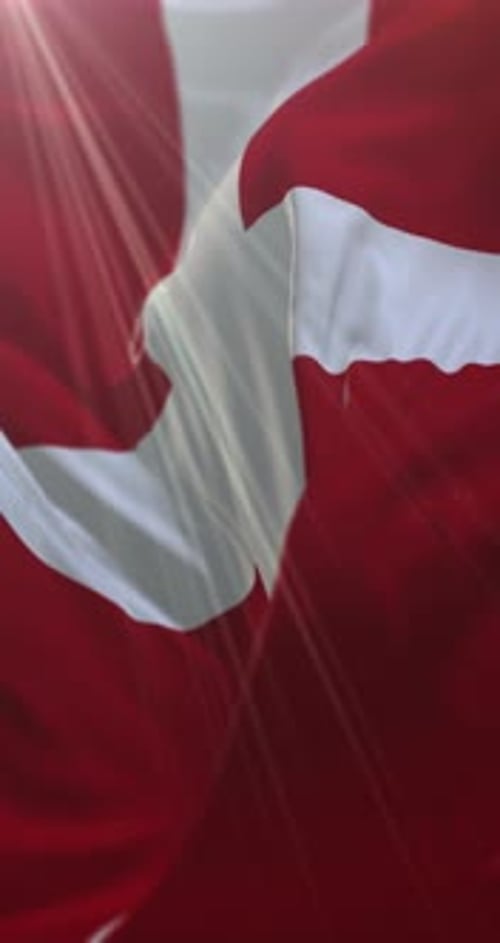Danish Flag Waving with Sunlight Rays