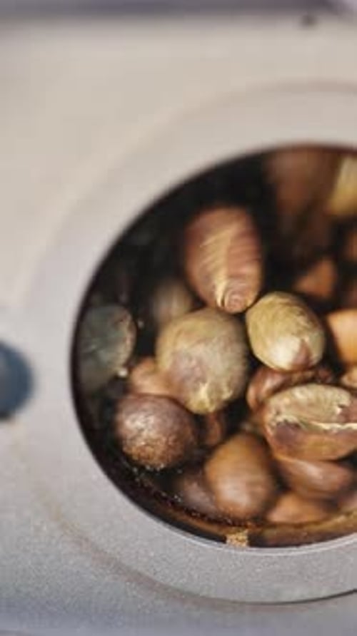 View of Raw Coffee Beans Through Control Window of a Coffee Roasting Oven