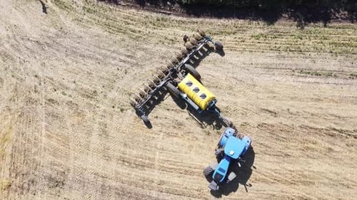 Blue Tractor O.A. Planting Canola On No Till Field