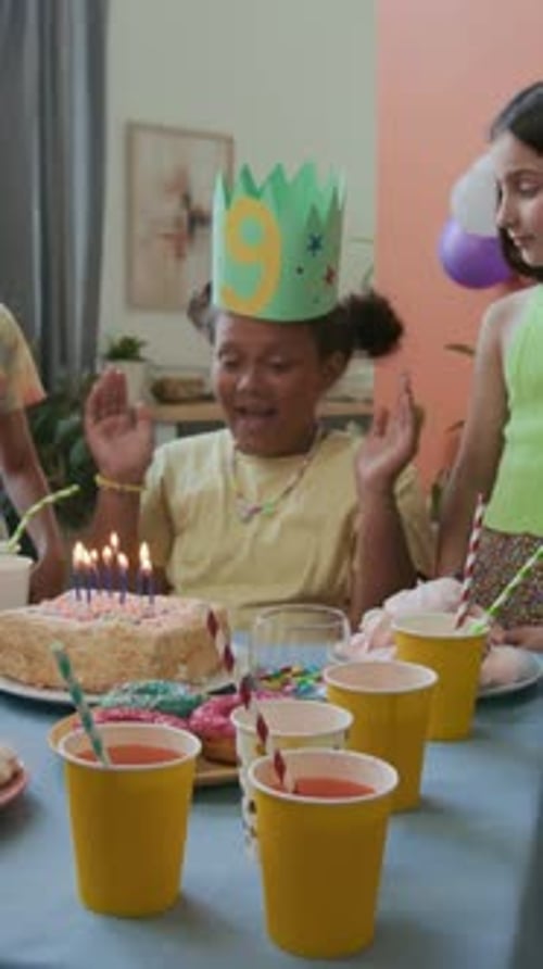 Happy Girl Celebrates Birthday with Friends at Home