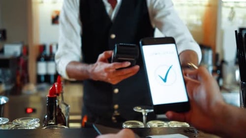 Contactless Payment Success Phone Taps Terminal Transaction Completed at Bar