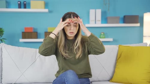 Young girl with migraine.