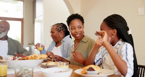 Family Members Eating Lunch Together at a Table