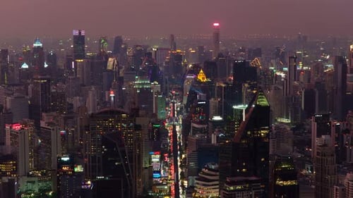Aerial Perspective of Bangkok's Bustling Cityscape at Night Luminous Skyscrapers and Towers Light
