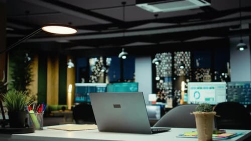 Empty Corporate Boardroom at Night Glows with Digital Displays