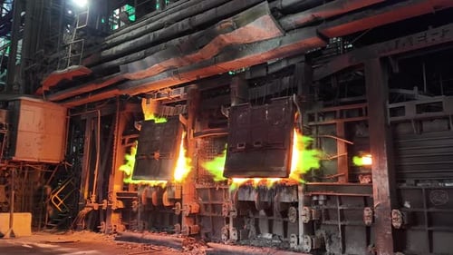 Molten Copper Flames at Industrial Smelter Furnace