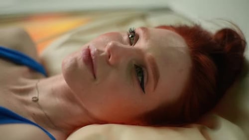 Redhead Woman Lying Down Relaxing on Pillow