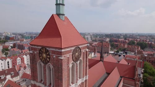 Drone Flight Around the Ancient Cathedral in the Center of the Old European Town with Tile Roofs