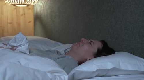 Woman Getting Out of Bed in the Morning