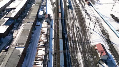 Train Passing By Industrial Zone at Winter Aerial View