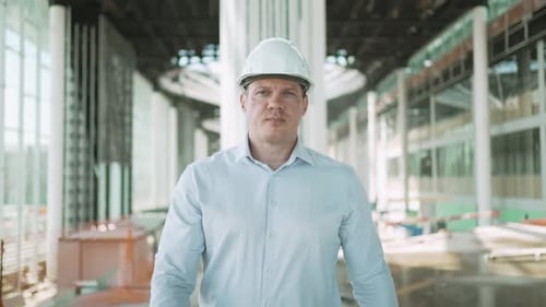 Construction Worker Architect Indoors Engineer Man Building Construction Site Looking at Camera