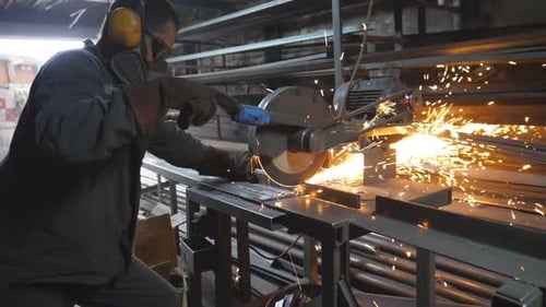 Man Use Saw Cutting Machine to Cut Metal Unrecognizable Guy with Circular Saw Sawing Steel in Garage