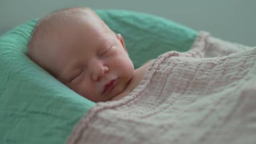 Peaceful Infant Sleeping Soundly in Crib