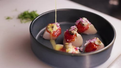 Gourmet Food in a Bowl Getting Sauce Drizzled