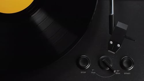 Vinyl Record Spinning on a Black Turntable