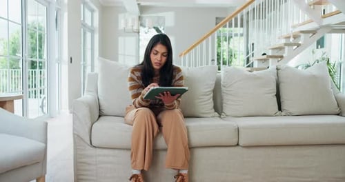 Home, stress and woman with tablet, headache and unhappy with low credit score, pressure and lounge