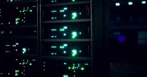 Data Center with Illuminated Server Racks Operating at Night