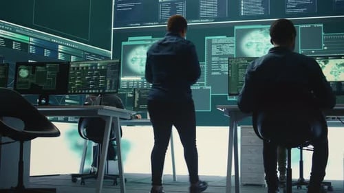 Two People Working at Computers in High Tech Office