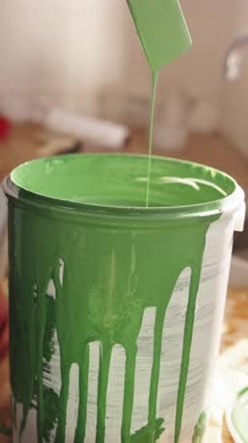 Hand, mix and paint can with person in apartment for diy project or home improvement