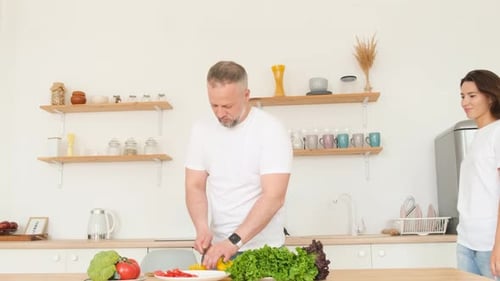Affectionate Couple Preparing Healthy Food in Kitchen