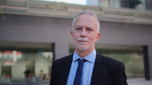 Adult Man in Suit Smiling at Camera