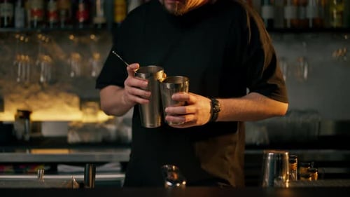 Bartender Making Red Cocktail in an Urban Bar