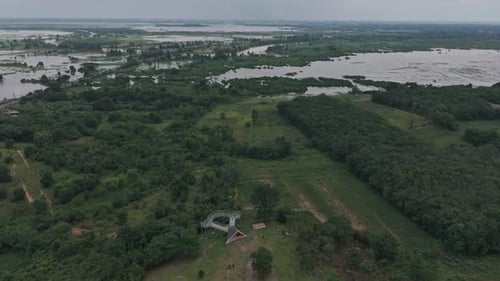 Aerial View Of A Landscape With A House And Flooded Fields