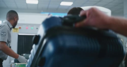 Airport Security Checkpoint Conveyor Belt and Passengers