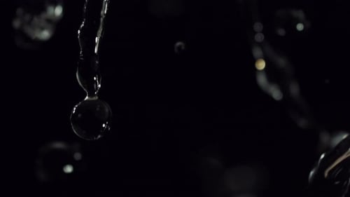 Water Droplets Falling in Slow Motion on Black