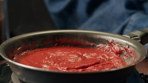 Simmering Red Sauce in a Pan on the Stove