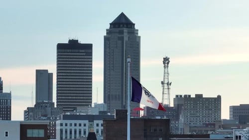 Iowa State Flag Waving in Des Moines Skyline
