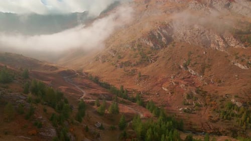 Scenic View Of Clouds Rolling Over The Valleys And Mountains During Morning In Autumn At Piemonte, I