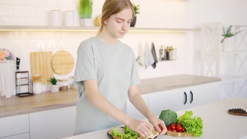 Girl Making a Healthy Sandwich in Kitchen