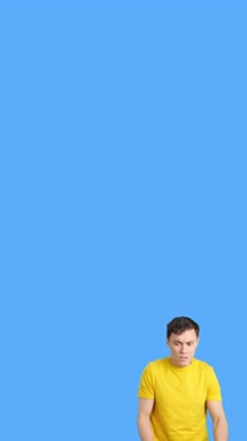 Man Looks Up in Fear on Blue Background