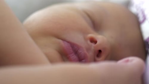 Beautiful newborn baby sleeping sweet, close up macro view