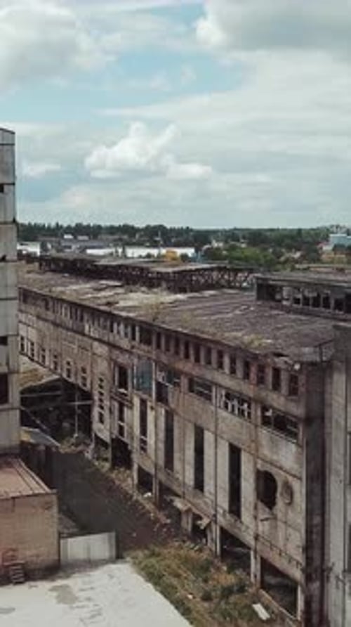 Flight over the destroyed factory. Old industrial building for demolition. Aerial view.