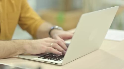 Close up of Hands Typing on Laptop