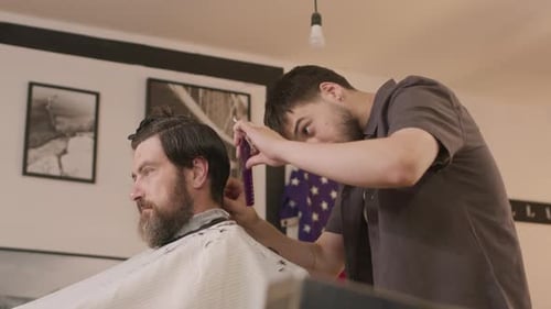 Man Gets Haircut at Modern Barber Shop