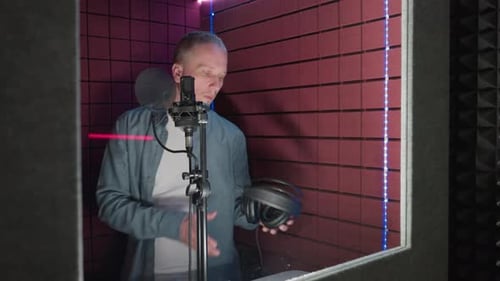 Singer Prepares to Record a Song in Studio