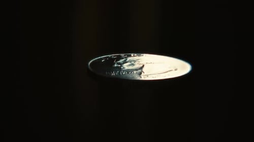 US Quarter Coin Flipping In The Air