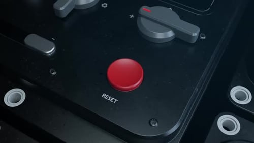 Red Reset Button Press on Control Panel