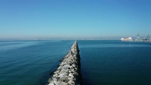 A long pass over the breaker wall in the bay. Built to tame the larger waves that might develop and