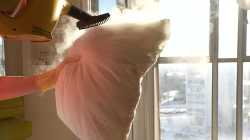 Steaming a White Pillow for Cleaning and Sanitizing